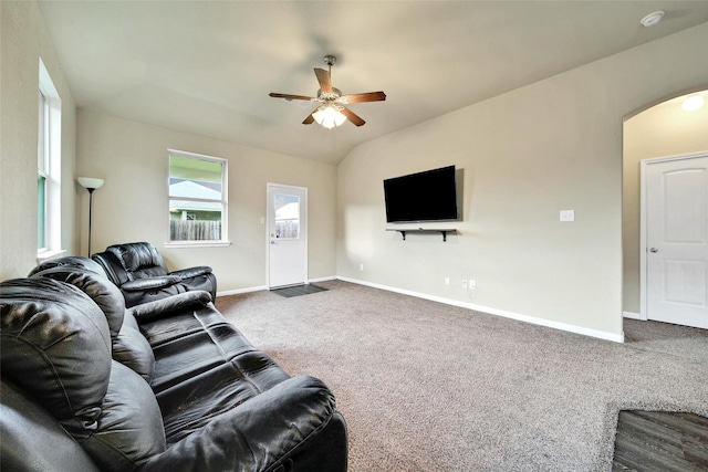 7427 Wheatley Gardens Dr, Houston, TX 77016 - living room featuring arched walkways, a ceiling fan, carpet flooring, and lofted ceiling