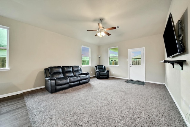 7427 Wheatley Gardens Dr, Houston, TX 77016 - carpeted living room with ceiling fan and baseboards