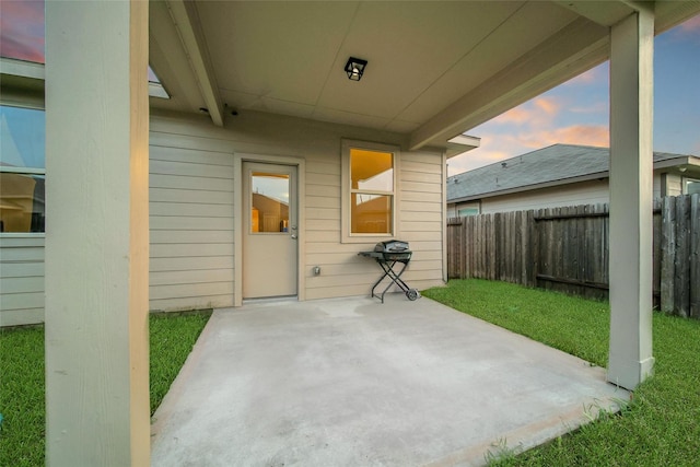 7427 Wheatley Gardens Dr, Houston, TX 77016 - patio terrace at dusk featuring a patio and a fenced backyard