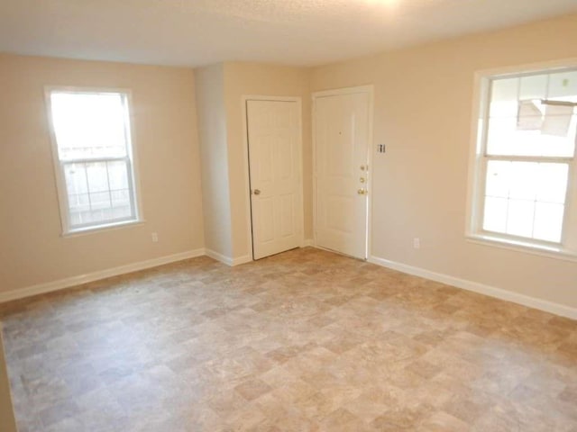 4218 Buck St, Houston, TX 77020 - spare room featuring healthy amount of natural light and light flooring