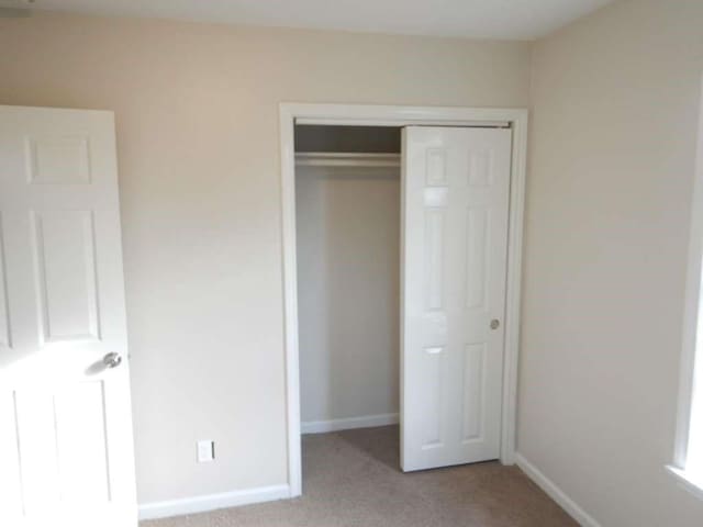 4218 Buck St, Houston, TX 77020 - unfurnished bedroom featuring a closet and light colored carpet