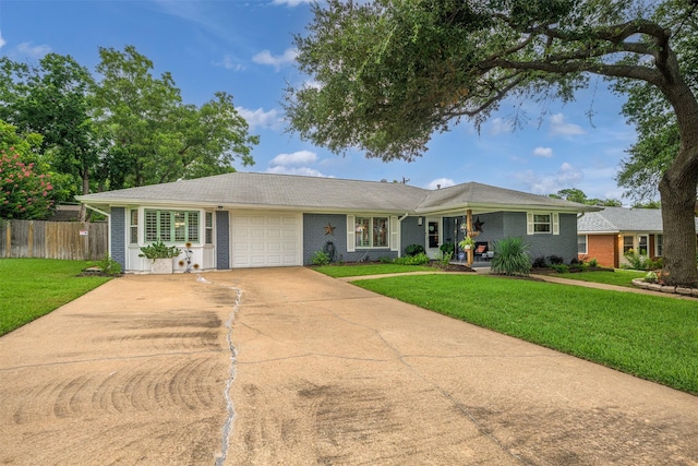 502 Spinn St, Brenham, TX 77833 - ranch-style house with a garage, brick siding, and concrete driveway
