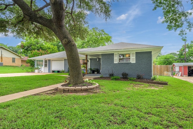 502 Spinn St, Brenham, TX 77833 - single story home with a garage, concrete driveway, and brick siding