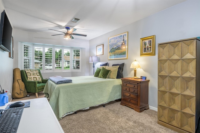 502 Spinn St, Brenham, TX 77833 - bedroom with light carpet and ceiling fan
