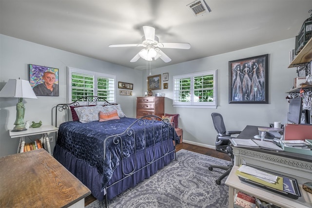 502 Spinn St, Brenham, TX 77833 - bedroom featuring wood finished floors, a desk, and a ceiling fan