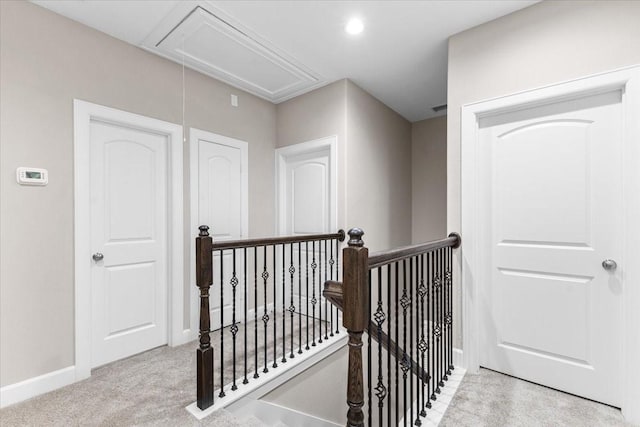 7970 Fowlie St, Houston, TX 77028 - corridor featuring attic access, an upstairs landing, and carpet