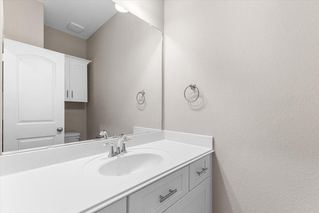 7970 Fowlie St, Houston, TX 77028 - bathroom with vanity and a textured wall