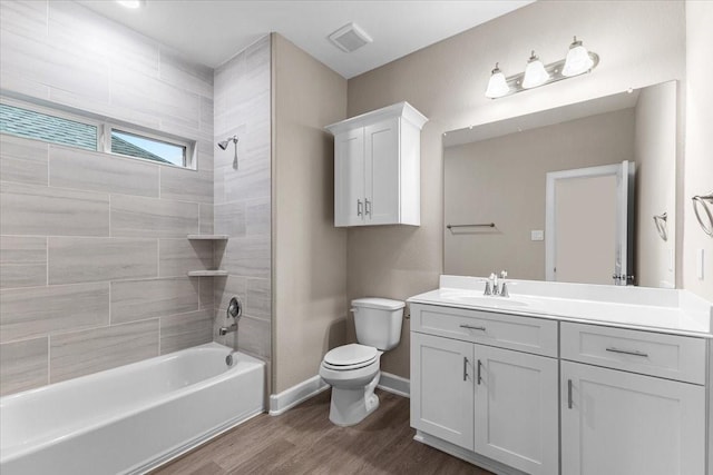 7970 Fowlie St, Houston, TX 77028 - full bath featuring vanity, wood finished floors, and shower / tub combination