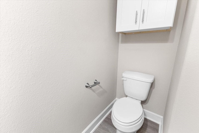 7970 Fowlie St, Houston, TX 77028 - bathroom with baseboards and wood finished floors