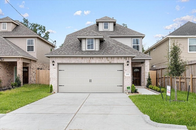 7970 Fowlie St, Houston, TX 77028 - traditional-style house featuring brick siding, roof with shingles, concrete driveway, and a garage
