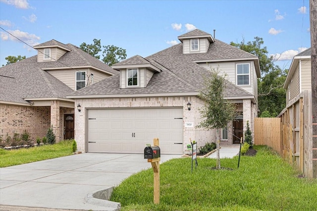 7970 Fowlie St, Houston, TX 77028 - traditional home with a shingled roof, an attached garage, driveway, and brick siding