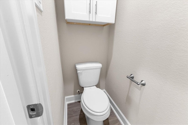 7970 Fowlie St, Houston, TX 77028 - bathroom featuring baseboards and wood finished floors