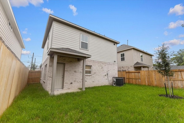 7970 Fowlie St, Houston, TX 77028 - back of property with brick siding, a fenced backyard, and a shingled roof