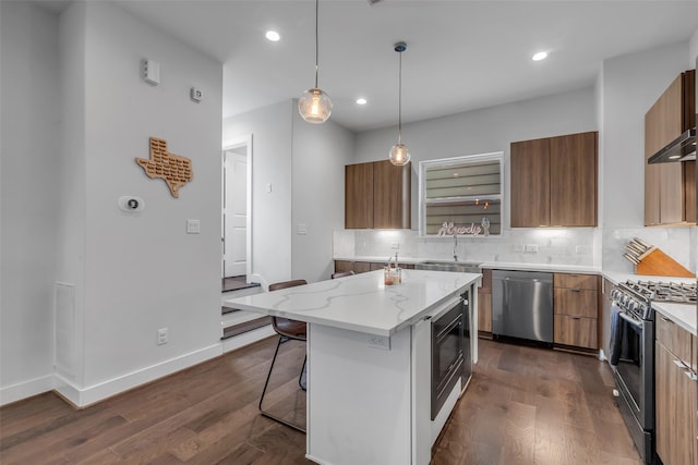 413 N Nagle St Unit B, Houston, TX 77003 - kitchen with appliances with stainless steel finishes, modern cabinets, brown cabinets, and recessed lighting