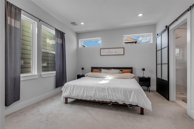 413 N Nagle St Unit B, Houston, TX 77003 - bedroom featuring a barn door, light colored carpet, and recessed lighting