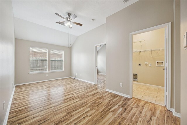 2708 Courtyard Ln, Pearland, TX 77584 - spare room with light wood finished floors, a ceiling fan, attic access, and vaulted ceiling