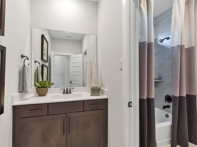 1588 River Point Dr, Friendswood, TX 77546 - full bathroom with vanity, shower / tub combo, and a textured wall