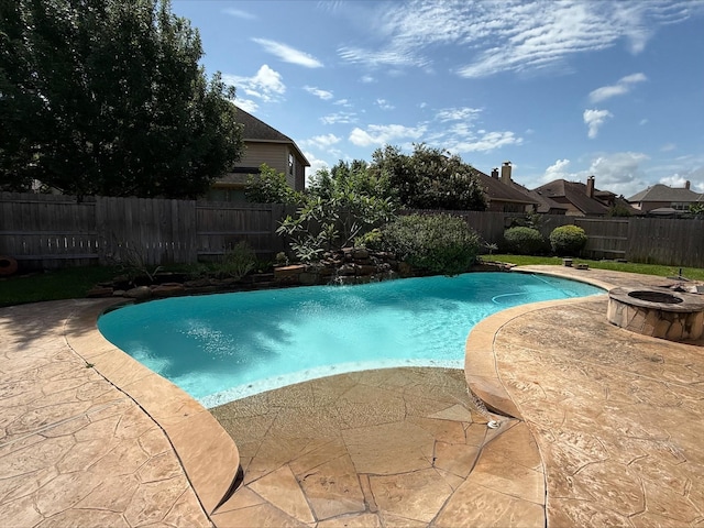 19011 Royal Cove Cir, Cypress, TX 77433 - view of swimming pool with a fenced backyard, a patio, and a fire pit