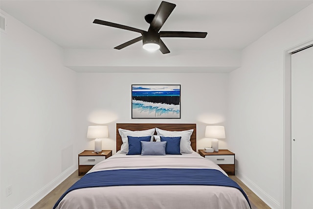 355 N Post Oak Ln Unit 839, Houston, TX 77024 - bedroom featuring wood finished floors and ceiling fan