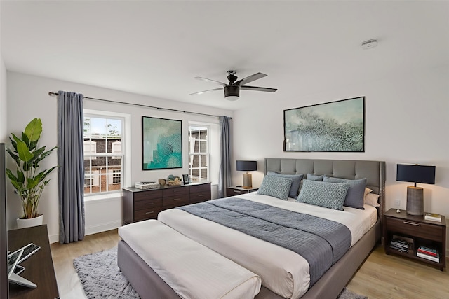 355 N Post Oak Ln Unit 839, Houston, TX 77024 - bedroom with light wood-type flooring and ceiling fan