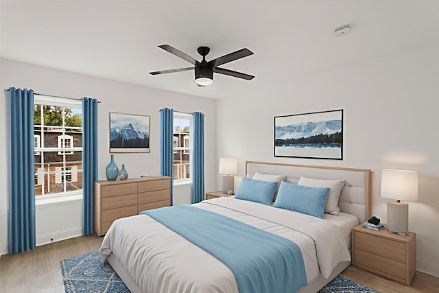 355 N Post Oak Ln Unit 839, Houston, TX 77024 - bedroom with light wood-style floors and ceiling fan