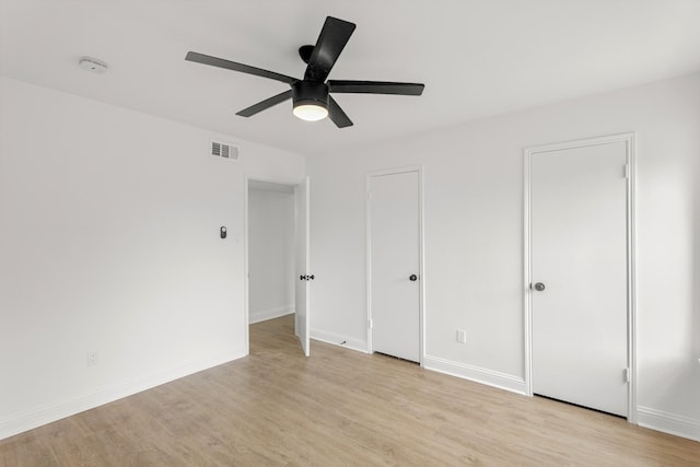 355 N Post Oak Ln Unit 839, Houston, TX 77024 - unfurnished bedroom featuring light wood-style floors and ceiling fan