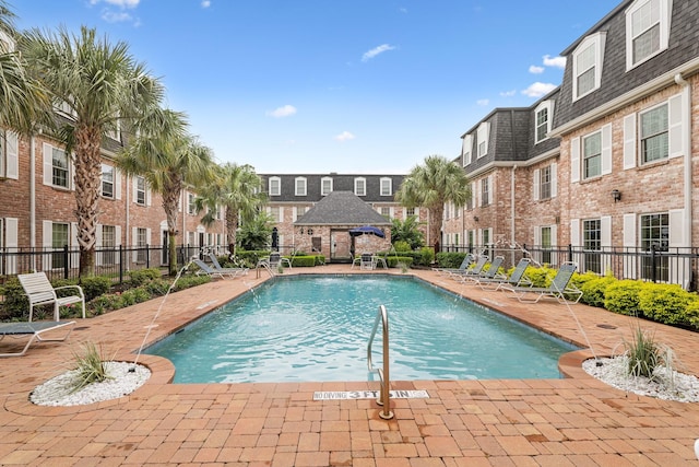 355 N Post Oak Ln Unit 839, Houston, TX 77024 - community pool featuring a residential view and a patio