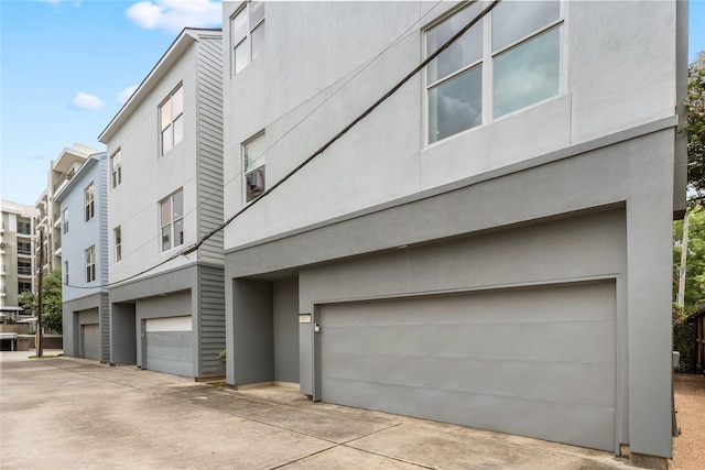1801 Oneil St Unit C, Houston, TX 77019 - view of property with an attached garage and concrete driveway