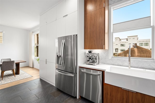 1801 Oneil St Unit C, Houston, TX 77019 - kitchen with stainless steel appliances, plenty of natural light, and modern cabinets