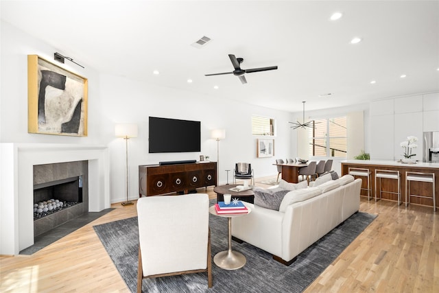 1801 Oneil St Unit C, Houston, TX 77019 - living room featuring light wood-style flooring, ceiling fan, recessed lighting, and a fireplace with flush hearth