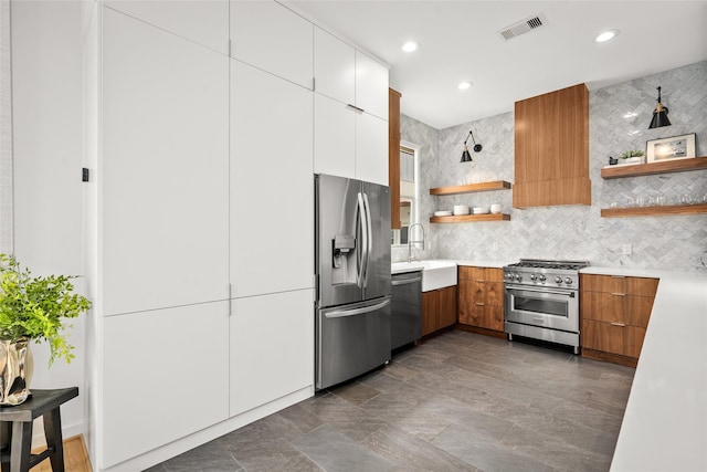 1801 Oneil St Unit C, Houston, TX 77019 - kitchen with appliances with stainless steel finishes, open shelves, light countertops, backsplash, and modern cabinets