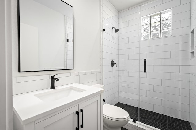 1801 Oneil St Unit C, Houston, TX 77019 - bathroom with a shower stall, vanity, and tile walls