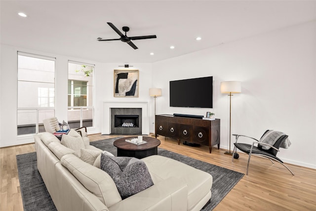 1801 Oneil St Unit C, Houston, TX 77019 - living room with wood finished floors, a ceiling fan, a tiled fireplace, and recessed lighting