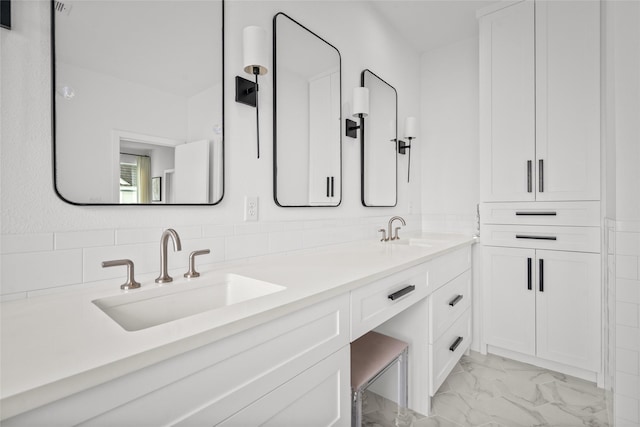 1801 Oneil St Unit C, Houston, TX 77019 - bathroom featuring marble look tiles and double vanity