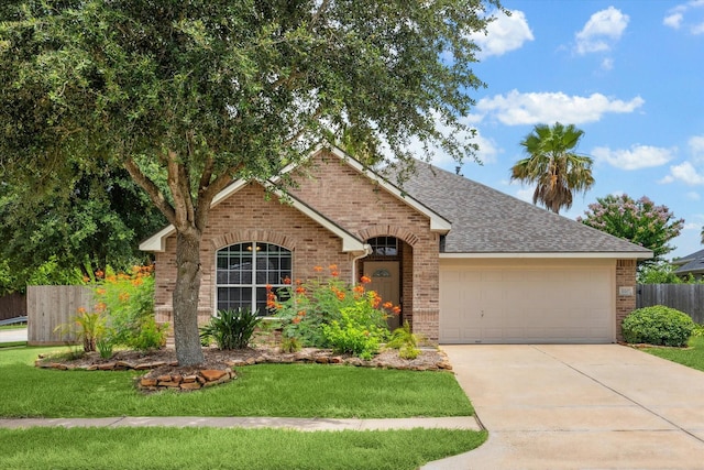 10207 Olive Mount St, Pearland, TX 77584 - view of front of property featuring brick siding, a garage, roof with shingles, and driveway