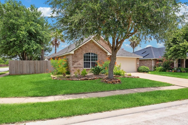 10207 Olive Mount St, Pearland, TX 77584 - view of front facade with brick siding, an attached garage, driveway, and roof with shingles
