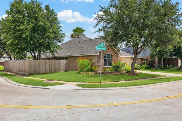 10207 Olive Mount St, Pearland, TX 77584 - view of front of property featuring brick siding, a shingled roof, and concrete driveway