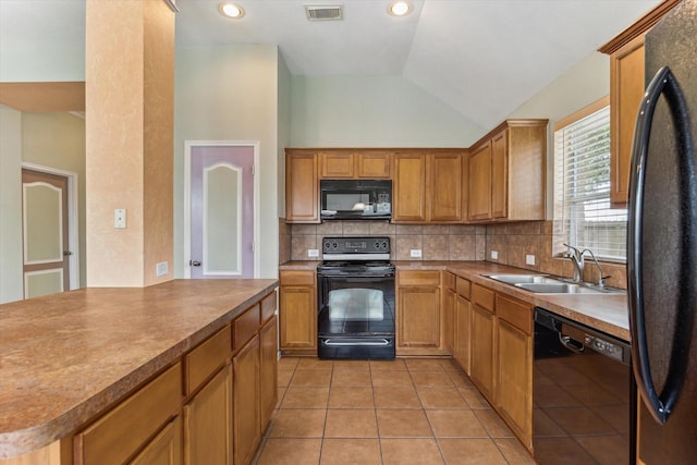 10207 Olive Mount St, Pearland, TX 77584 - kitchen featuring black appliances, tasteful backsplash, lofted ceiling, light tile patterned floors, and brown cabinets