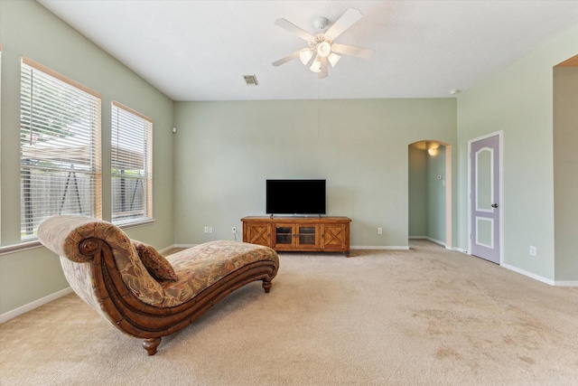 10207 Olive Mount St, Pearland, TX 77584 - carpeted living room featuring arched walkways and ceiling fan