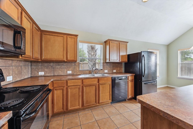 10207 Olive Mount St, Pearland, TX 77584 - kitchen featuring black appliances, lofted ceiling, tasteful backsplash, brown cabinetry, and light tile patterned floors