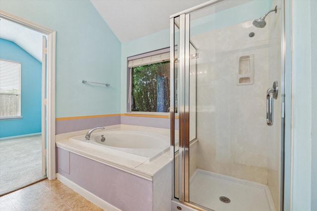 10207 Olive Mount St, Pearland, TX 77584 - bathroom with vaulted ceiling, a shower stall, a garden tub, tile patterned floors, and plenty of natural light
