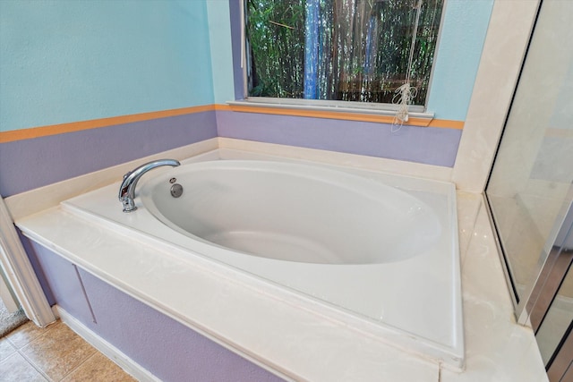 10207 Olive Mount St, Pearland, TX 77584 - full bath featuring a bath and tile patterned floors