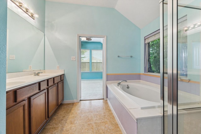 10207 Olive Mount St, Pearland, TX 77584 - bathroom featuring vaulted ceiling, a bath, and double vanity