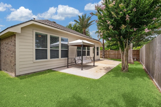 10207 Olive Mount St, Pearland, TX 77584 - rear view of property with brick siding, a fenced backyard, a patio area, and a gazebo
