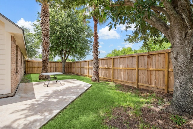10207 Olive Mount St, Pearland, TX 77584 - fenced backyard with a patio