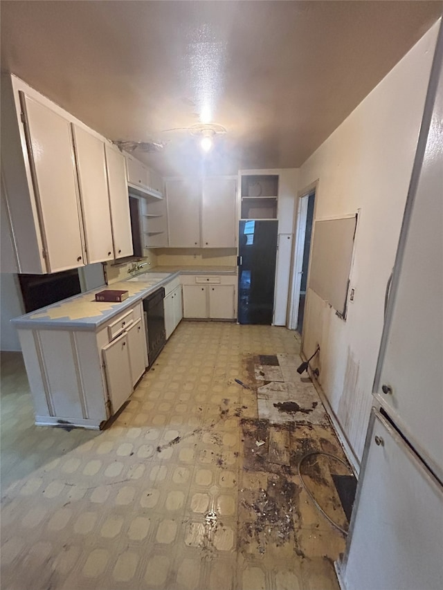 1904 Lillian St, Pasadena, TX 77502 - kitchen with black appliances, light floors, white cabinetry, light countertops, and open shelves