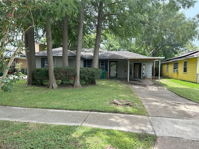 1904 Lillian St, Pasadena, TX 77502 - ranch-style home featuring concrete driveway, a front lawn, and a carport