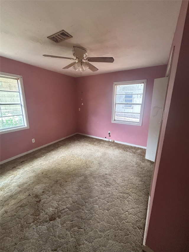 1904 Lillian St, Pasadena, TX 77502 - empty room featuring plenty of natural light, ceiling fan, and carpet