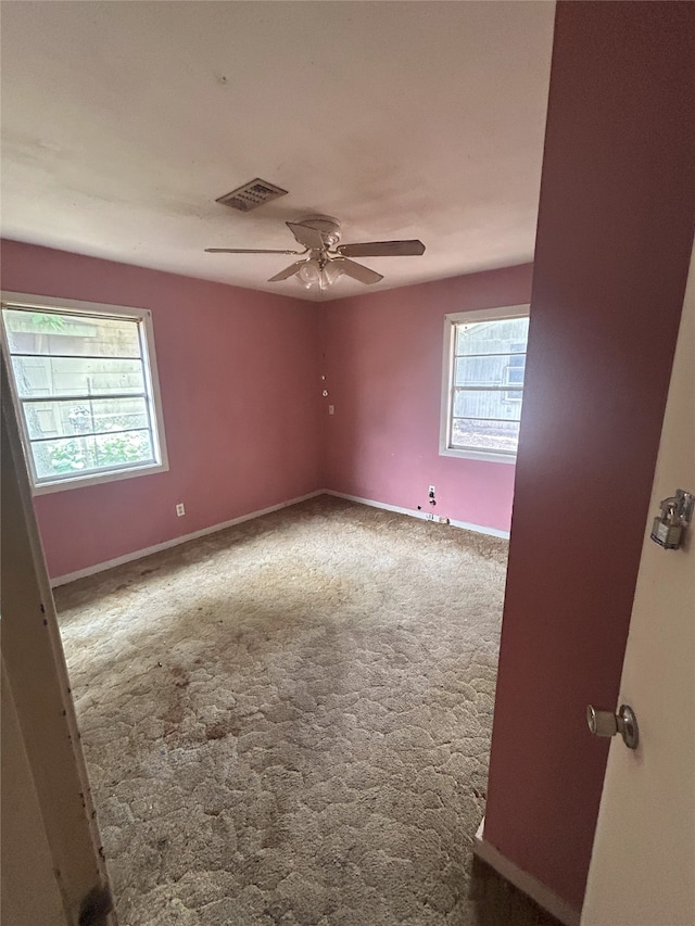 1904 Lillian St, Pasadena, TX 77502 - spare room featuring carpet, plenty of natural light, and a ceiling fan