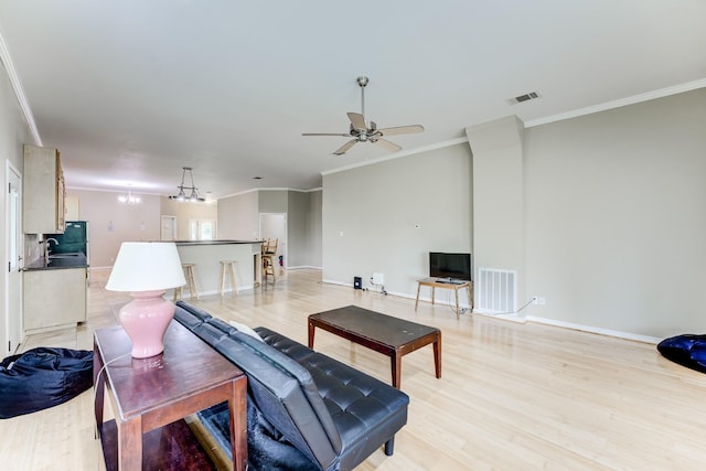 131 Canary Ln, Coldspring, TX 77331 - living area featuring ceiling fan, ornamental molding, and light wood-type flooring